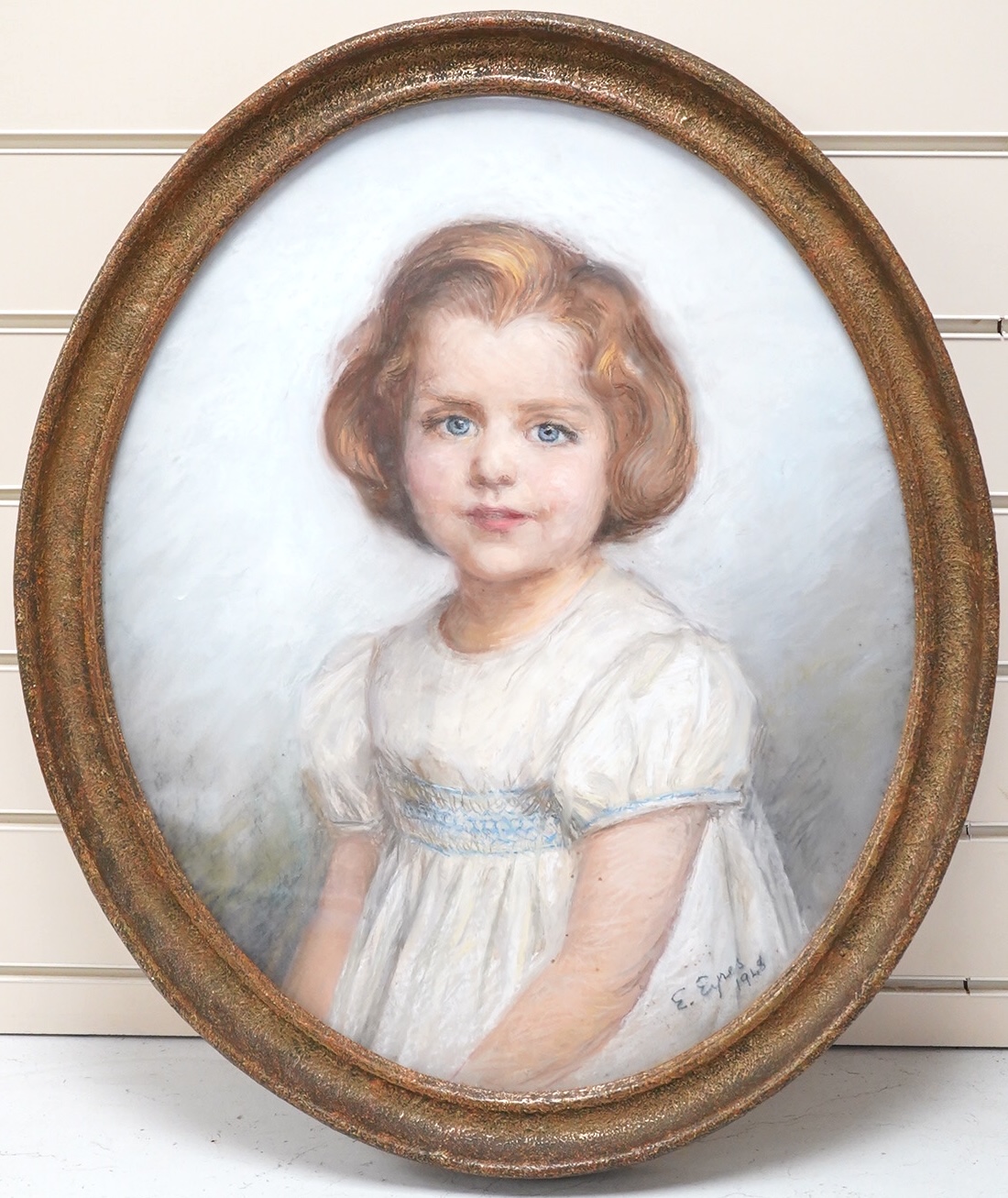 E. Eyres, Portrait of a young girl, signed and dated 1948, oval pastel, 52 x 44cm